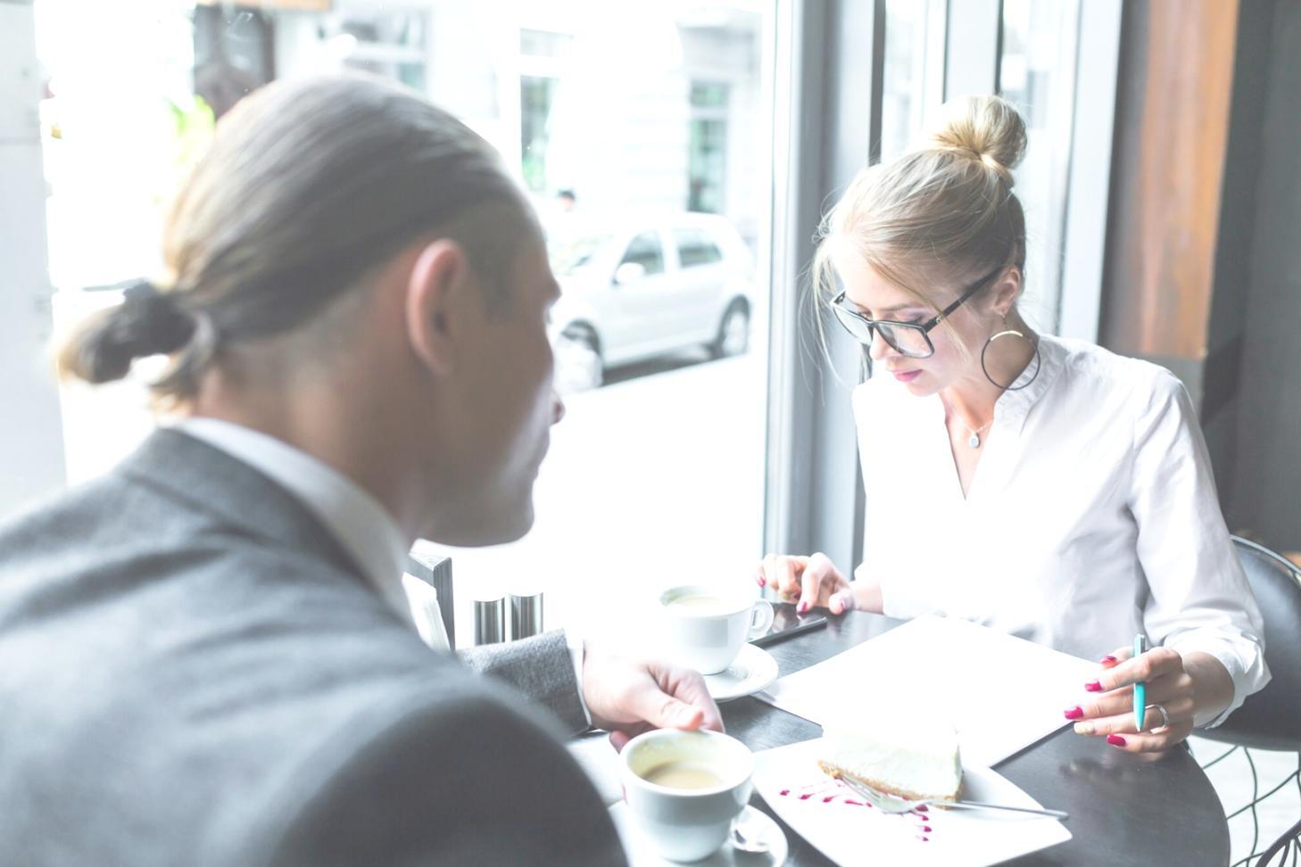 Finance team members practicing presentation techniques in collaborative learning environment